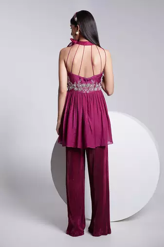 Beautiful Peplum Top With Tie Up At The Neckline Paired With Crush Fabric Pants.