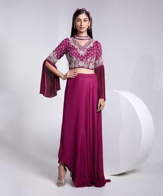 A Fllawless V Neckline Crop Top Emrbiodered Uniquely. The Sleeve Has Cut Flare Details. The Skirt Is Pre Draped. 1