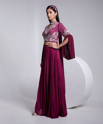 A Fllawless V Neckline Crop Top Emrbiodered Uniquely. The Sleeve Has Cut Flare Details. The Skirt Is Pre Draped. 2