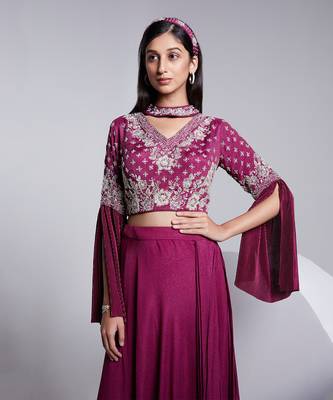 A Fllawless V Neckline Crop Top Emrbiodered Uniquely. The Sleeve Has Cut Flare Details. The Skirt Is Pre Draped. 3