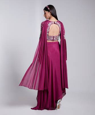 A Fllawless V Neckline Crop Top Emrbiodered Uniquely. The Sleeve Has Cut Flare Details. The Skirt Is Pre Draped. 4