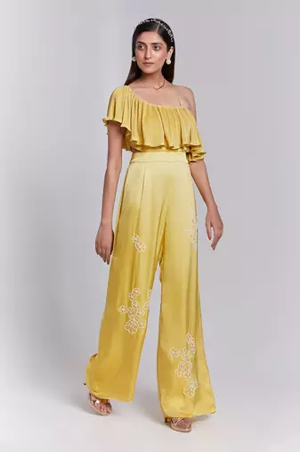 Jumpsuit With One Shoulder Ruffle Details The Pants Have Hand Embroidery