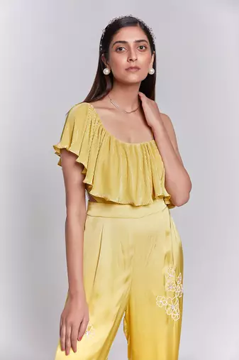 Jumpsuit With One Shoulder Ruffle Details The Pants Have Hand Embroidery