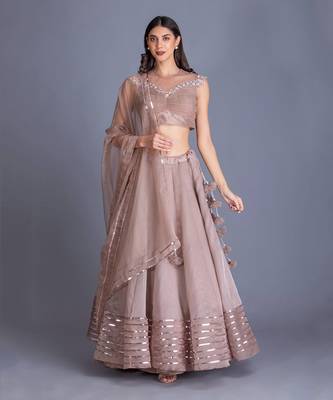Look Chic & Minimal In Our Champange Gold Lehnga With Ruching Details At The Blouse And Sequin Stripes At The Bottom 1