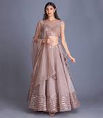 Look Chic & Minimal In Our Champange Gold Lehnga With Ruching Details At The Blouse And Sequin Stripes At The Bottom