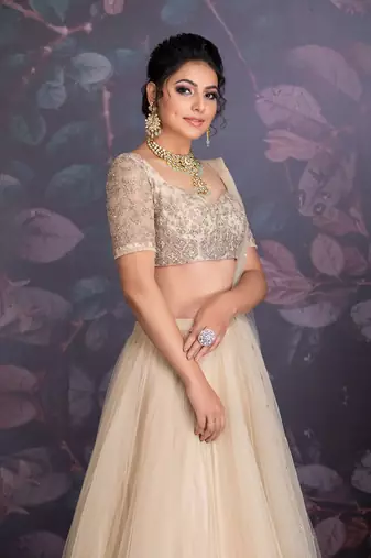 Baize Green Tuelle Lehenga With Back Trail Clubbed With Hand Embroidered Zardozi Work Blouse And Drapped Dupatta.