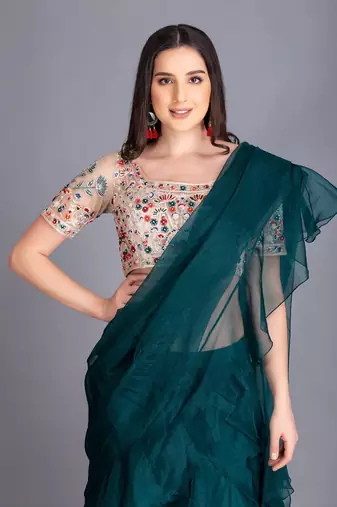 A Must Have For Your Word Ruffled Drapped Save With Multi Colour Thread Work Embroidery On The Blouse