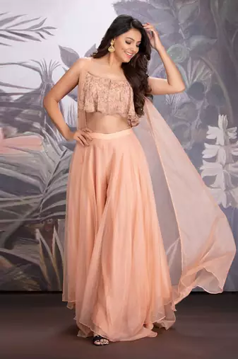 Peach Bloom Georgette Hand Embroidered Blouse Clubbed With Layered Organza Pants And Flared Organza Cape.