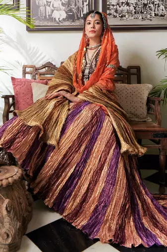 Pink Gold Maroon And Purple Textured Gota Lehenga Velvet Zardozi Sequined Blouse And Organza Gold Checkered Dupatta.