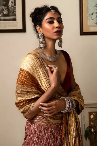 Maroon And Gold Flock Printed Crushed Gota Lehenga Maroon Velvet Blouse And Crushed Dupatta.