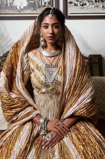 Silver And Gold Chevron Textured Gota Lehenga Textured Peplum Blouse And Crushed Dupatta.