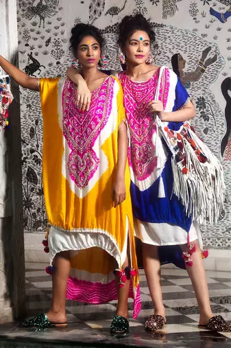 Golden yellow high-low double layered kaftan embellished with gota, mirrors and drawstring details.