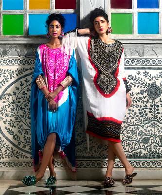 White gajji silk kaftan with gota and mirror embellished neck, tassels at the hem. 3