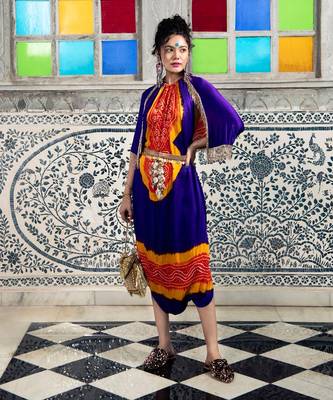 Purple and orange jumpsuit with cape jacket highlighted with gold and gota tassels. 1