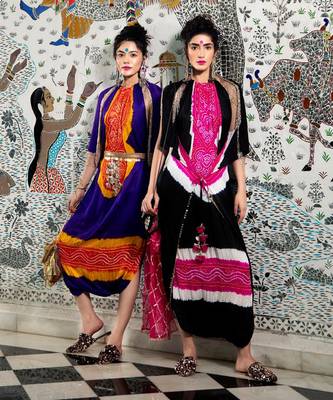 Purple and orange jumpsuit with cape jacket highlighted with gold and gota tassels. 2