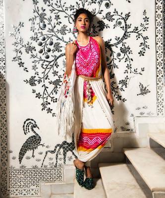 Cream and fuchsia gajji silk dhoti with halter blouse embellished with gota tassels. 1