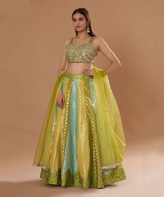 Mirrorwork Fully Embroidered Choli With A Turquoise,Yellow And Lime Green Mehendi Lehenga. 1