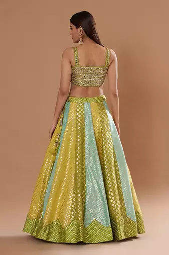 Mirrorwork Fully Embroidered Choli With A Turquoise,Yellow And Lime Green Mehendi Lehenga.