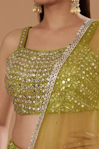 Mirrorwork Fully Embroidered Choli With A Turquoise,Yellow And Lime Green Mehendi Lehenga.