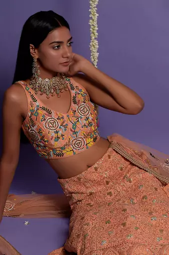 Dusky Peach Heavy Embroidered Lehenga With Light V Neck Crop Top