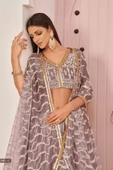 Pink embroidered net semi stitched lehenga