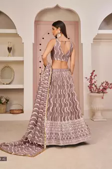 Pink embroidered net semi stitched lehenga