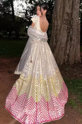 Dazzling Off-white Thread embroidered with papep mirror work georgette semi stitched lehenga choli with wedding