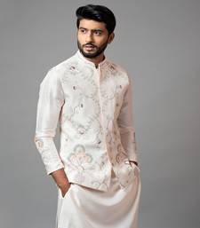 Baby pink Nehru jacket with Multi colour garden themed embroidery.
