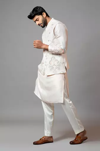 Baby pink Nehru jacket with Multi colour garden themed embroidery.