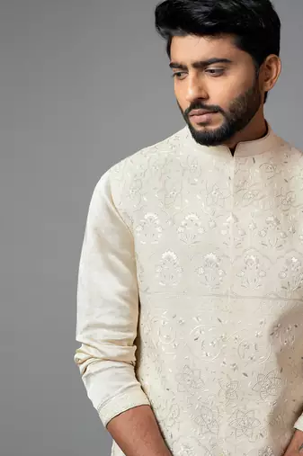 Cream Kora fully embroidered nehru.