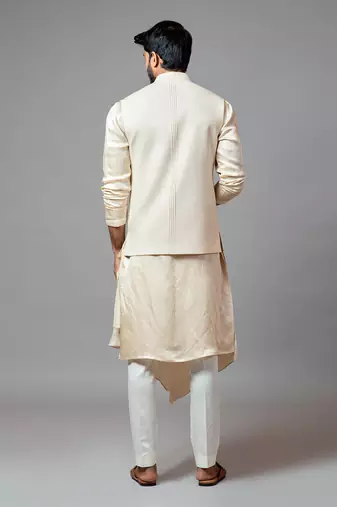 Cream Kora fully embroidered nehru.