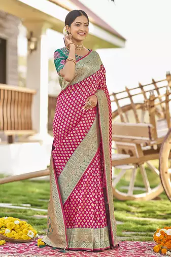 Pink woven Banarasi silk blend saree with blouse