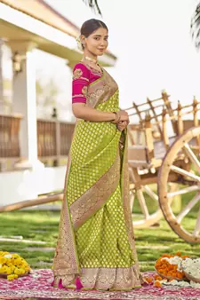 Green woven Banarasi silk blend saree with blouse