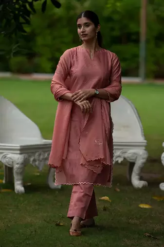 Peach coloured Zari Line Silk kurta set with Cutwork on Border & Embroidered Cutworked Dupatta