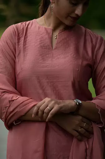 Peach coloured Zari Line Silk kurta set with Cutwork on Border & Embroidered Cutworked Dupatta