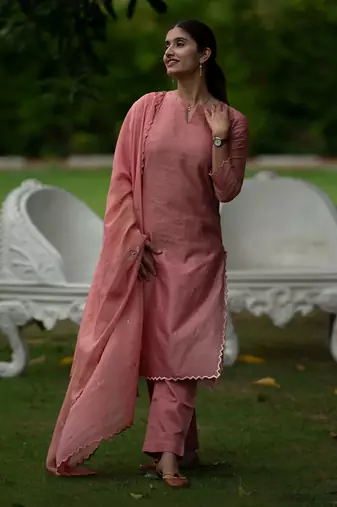 Peach coloured Zari Line Silk kurta set with Cutwork on Border & Embroidered Cutworked Dupatta