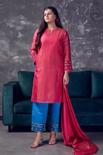 Pink coloured chanderi tissue kurta & sky blue coloured silk pant & dupatta with heavy sequense embroidery