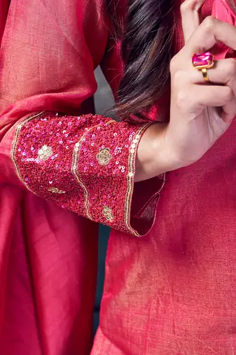 Pink coloured chanderi tissue kurta & sky blue coloured silk pant & dupatta with heavy sequense embroidery