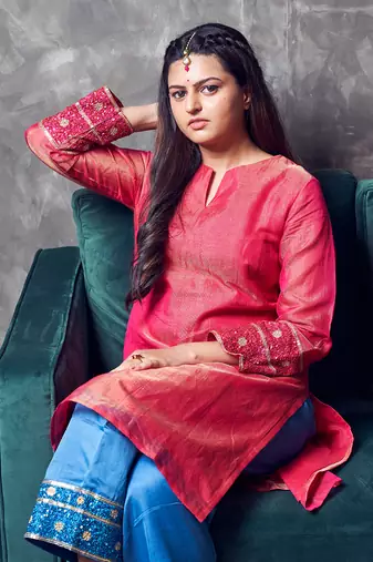 Pink coloured chanderi tissue kurta & sky blue coloured silk pant & dupatta with heavy sequense embroidery