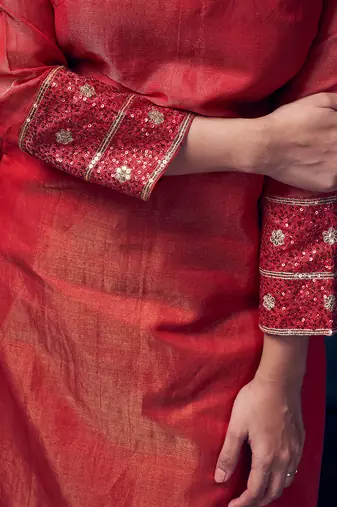 Red coloured chanderi tissue kurta & magenta coloured silk pant & dupatta with heavy sequense embroidery