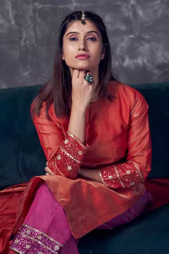 Red coloured chanderi tissue kurta & magenta coloured silk pant & dupatta with heavy sequense embroidery