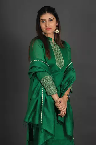 Green coloured chanderi silk set & dupatta with heavy beads & resham work