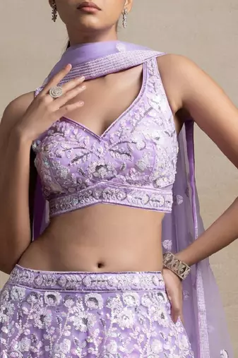 Astonishing Lavender Sequins Embroidered Soft Net Bridal Lehenga