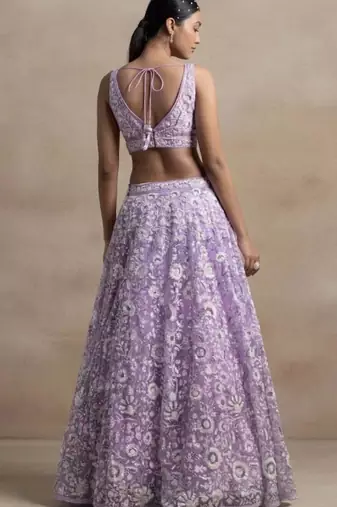 Astonishing Lavender Sequins Embroidered Soft Net Bridal Lehenga