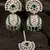 Rhodium plated hydro green stone jhumka with tikka