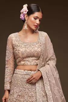 Glamorous Beige Embroidered Net Wedding Wear Lehenga Choli