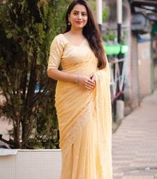 Yellow printed chiffon saree with blouse