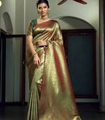 Green woven kanchipuram silk blend saree with blouse