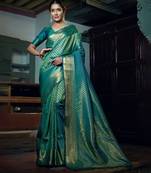 Green woven kanchipuram silk blend saree with blouse