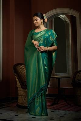 Green woven kanchipuram silk blend saree with blouse 1